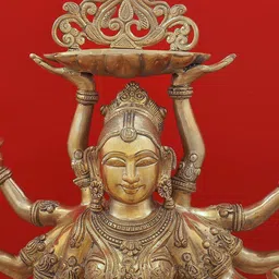 Exotic India Gold Toned Ten-Armed Auspicious Deepalakshmi With Each Hand Holding Lamp image 5