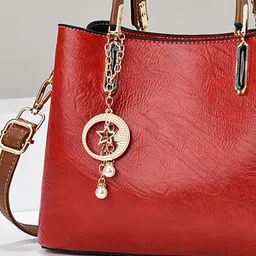 StyleCast Women Solid Structured Embellished Handheld Bag image 2