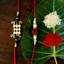 Karatcart Gold-Plated Kundan Rakhi with Roli Chawal & Greeting Card for Brother - Set of 2 image 1