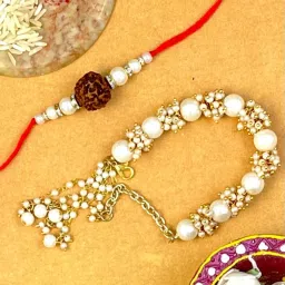 Karatcart Gold-Plated Handmade Kundan Rakhi, Roli & Chawal for Bhai & Bhabi - Set of 2 image 1