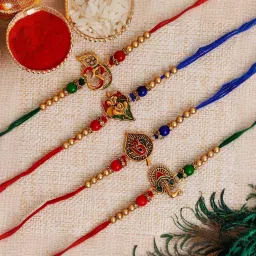 eCraftIndia Set of 4 Multicolor Religious Rakhis with Sibling Agreement & Roli Chawal Pack image 1