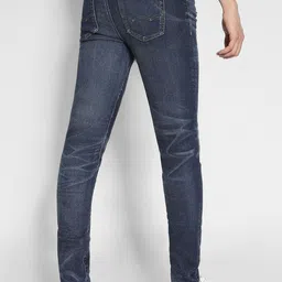 AMERICAN EAGLE OUTFITTERS Men Skinny Fit Mildly Distressed Light Fade Jeans image 2