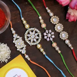 Karatcart Gold-Plated Handmade Kundan Rakhi with Roli & Chawal for Brother - Set of 4 image 1