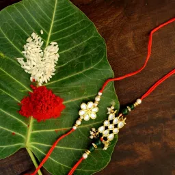 Karatcart Gold-Plated Kundan Rakhi with Roli Chawal & Greeting Card for Brother - Set of 2 image 1