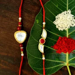 Karatcart Gold-Plated Kundan Rakhi with Roli Chawal & Greeting Card for Brother - Set of 2 image 1