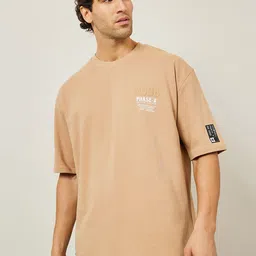 Styli Beige Typography Printed Round Neck Terry Cotton Oversized T-shirt with Woven Badge-image-81