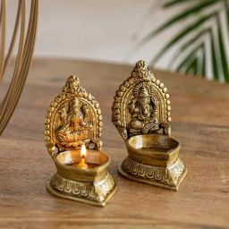 ExclusiveLane Golden Brass Handcarved Laxmi Ganesha Pair Diyas - Set of 2-picture-1