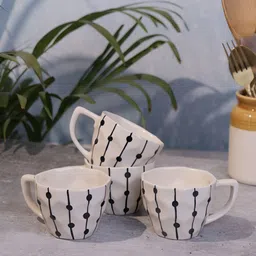 Myntra Elegant Homes Set of 4 Black Fairy Lights Off-white Ceramic Coffee Mugs-picture-18