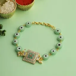 Aapno Rajasthan Gold Swastik Green Enameled Black Eye Bracelet Rakhi-picture-42