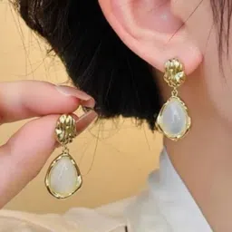 SUBHAGALANKAR Gold-Plated Artificial Stones Studded Oval Drop Earrings image 2