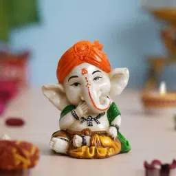 eCraftIndia White Polyresin Hcrafted Eating Lord Ganesha Idol While Sitting Showpieces-picture-30
