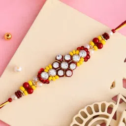 Aapno Rajasthan Yellow & Red Stones Beads Studded Floral Shape Rakhi-picture-11