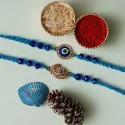eCraftIndia Set of 2 Evil Eye Rakhis for Brothers with Sibling Agreement & Roli Chawal Pack image 1