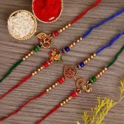 eCraftIndia Set of 4 Multicolor Religious Rakhis with Sibling Agreement & Roli Chawal Pack image 4