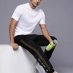 HRX by Hrithik Roshan Men Brand Logo Printed Rapid Dry Training Joggers image 4