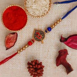 eCraftIndia Red & Blue Om Symbol On A Leaf Rakhi for Bhai with Sibling Agreement & Roli Chawal Pack-picture-49