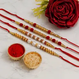 eCraftIndia Set of 4 Red, Golden, White Beads & Pearl Rakhis with Sibling Agreement & Roli Chawal image 2