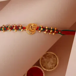 fnp Sneh Golden Touch Om Rakhi  American Diamond image 1