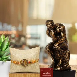 eCraftIndia Assorted Gold Rakhi with Man Showpiece image 1