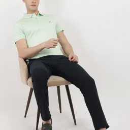 TOMMY HILFIGER Green Cotton Regular Fit Solid Polo T-Shirt image 4