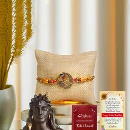 eCraftIndia Set Of 2 Peacock Design Rakhi With Adiyogi Shiva Idol & Roli Chawal image 1