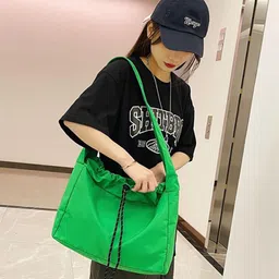 StyleCast x Revolte Bucket Tote Bag image 5