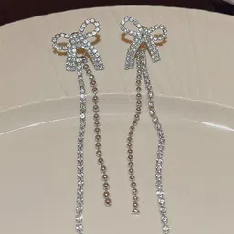 VAGHBHATT Silver-Plated Rhinestone Studded Bow Design Drop Earrings-picture-16