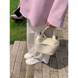 StyleCast x Revolte Bucket Sling Bag image 5