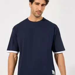 Styli Men Contrast Panel Oversized T-Shirt with Badge Detail image 1