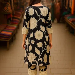 JANOI Women Floral Printed Regular Thread Work Kurta with Trousers image 3