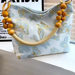 StyleCast Printed Structured Handheld Bag with Tasselled-image-69
