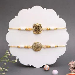 Myntra Elegant Homes Set Of 2 Gold Symbol Beaded Rakhis With Greeting Card & Roli Chawal-picture-37