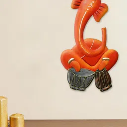 eCraftIndia Orange-Coloured & Black Handcrafted Musician Lord Ganesha Playing Dholak Wall Hanging Showpiece image 1