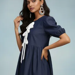 Dora Dori Women Colourblocked Puff Sleeve Tie-Up Denim Peplum Top image 3