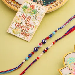 NVR Set Of 2 Evil Eye Artificial Beads Thread Rakhi with Roli Chawal Chandan & Mishri image 1