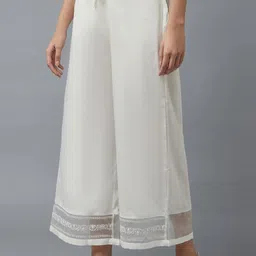 W Women White Solid Regular Fit Parallel Cropped Trousers image 4