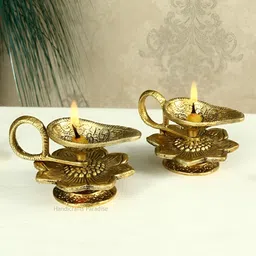 HANDICRAFTS PARADISE Gold Toned 2 Pcs Chirag & Flower Designed Antique Metal Pooja Diyas-image-88