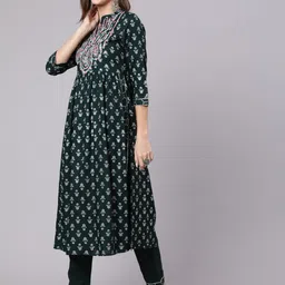 KIMAYRA Floral Printed Thread Work & Mirror Work A-line Kurta with Trousers image 4