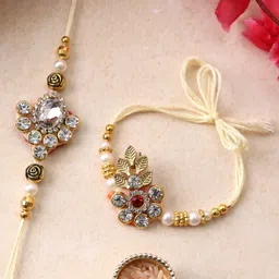 PANASH Set Of 2 Gold Plated Floral Shaped Rakhi with Roli Chawal With Roli Chawal image 1