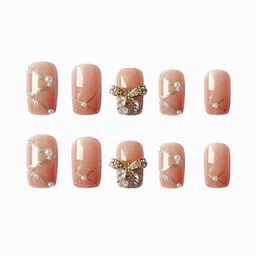 secret lives Designer Artifical extension nails with glue sheet nude shade with silver color bow and glitters design image 3