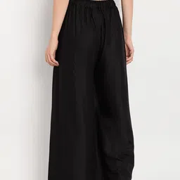 TAG 7 Women Black Solid Flared Palazzos image 5
